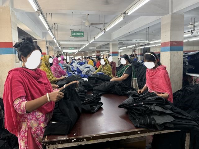 Skilled team members meticulously performing quality checks and finishing tasks to ensure garment perfection.